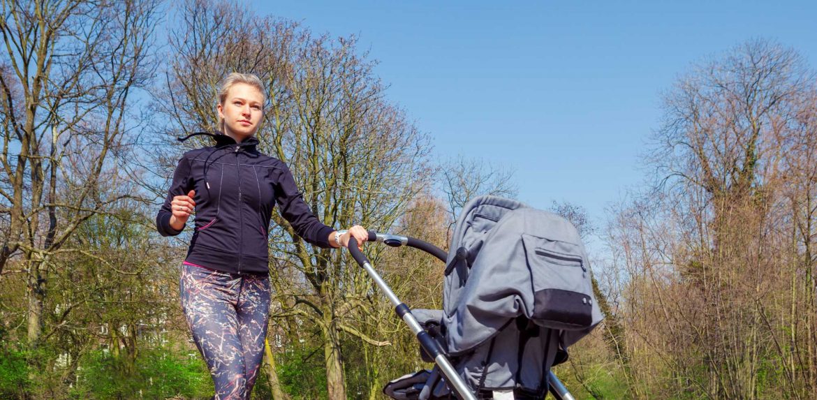 Mother jogging with stroller