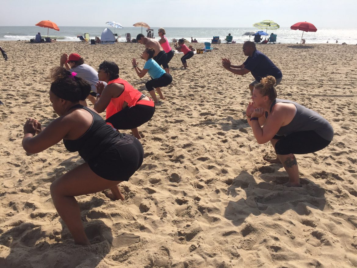 Squats on oceanfront with group