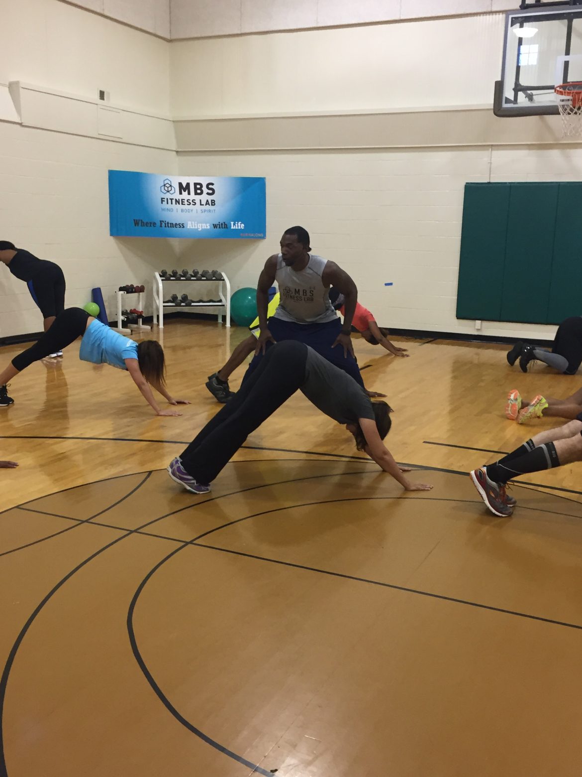 Core exercises while getting coached in gym