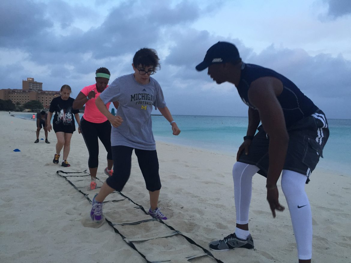 Fancy footwork on the beach with fitness trainer